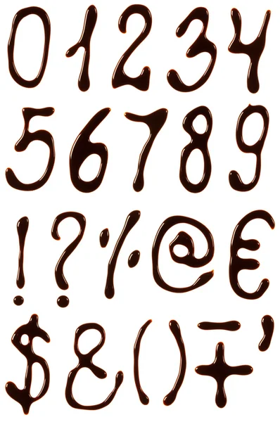 Numbers and symbols set written with chocolate syrup — Stock Photo, Image