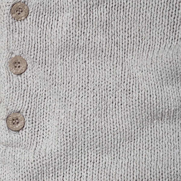 Grijs gebreide linnen textuur met knop — Stockfoto
