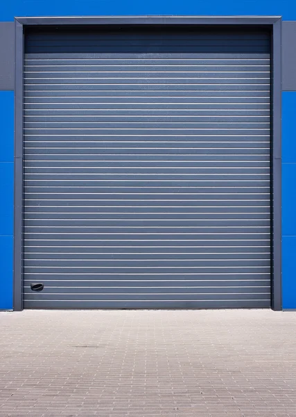 Building with metal roller shutter door — Stock Photo, Image