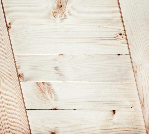 Light wooden planks texture with branch — Stock Photo, Image