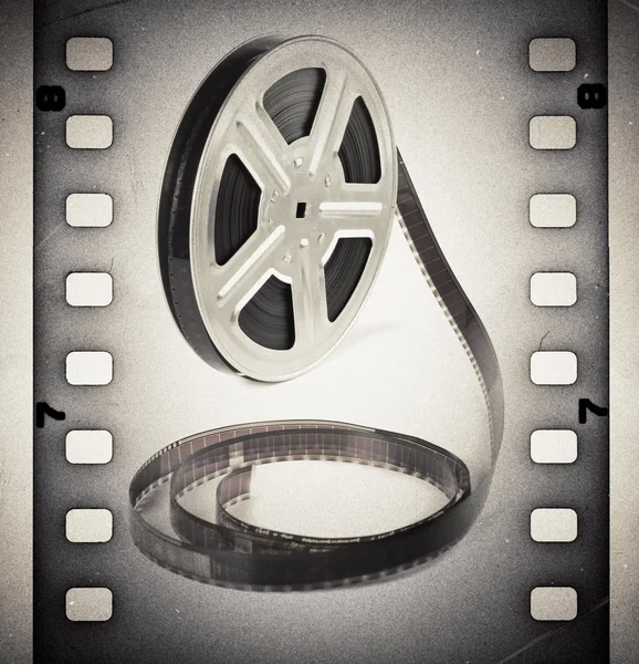 Old motion picture film reel with film strip. Vintage background — Stock Photo, Image