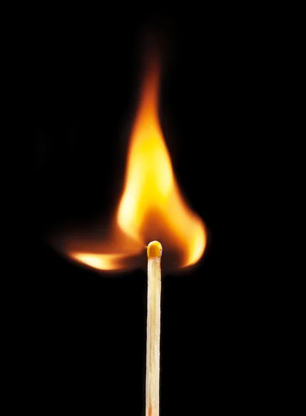 Burning matchstick on black background — Stock Photo, Image