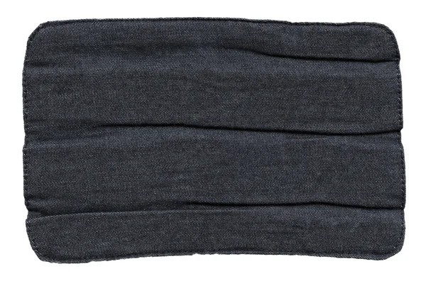 Creasy black jeans lable — Stock Photo, Image