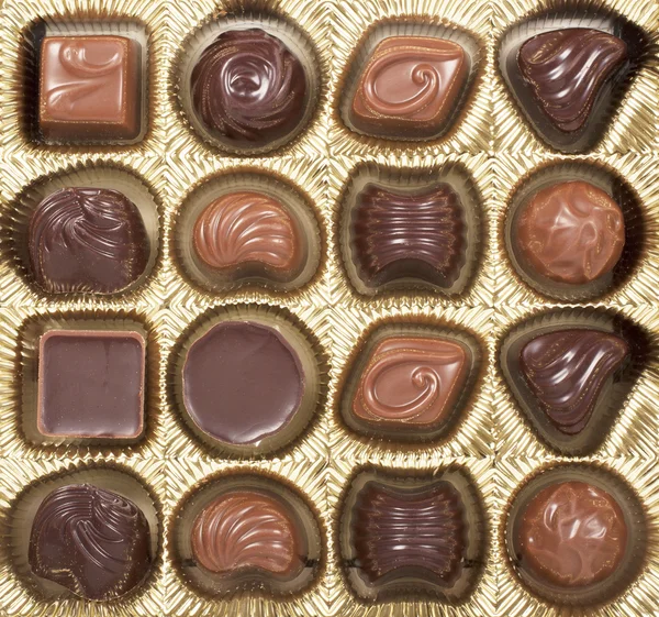 Golden box of various chocolate — Stock Photo, Image