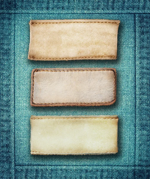 Brown leather jeans labels sewed on jeans. — Stock Photo, Image