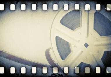 Old motion picture reel with film strip. clipart