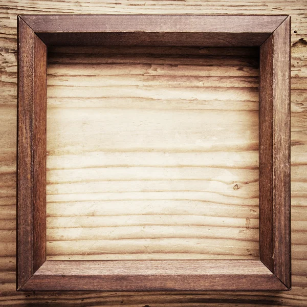 Vintage houten frame op hout achtergrond — Stockfoto