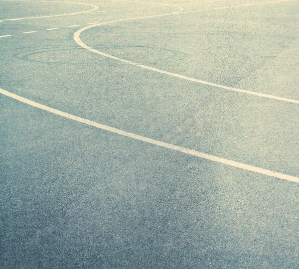 Grainy asphalt texture with lines. — Stock Photo, Image