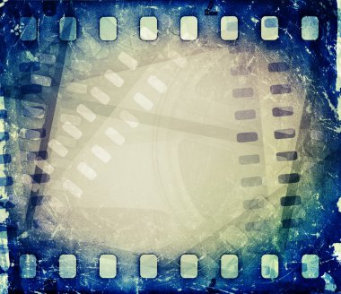 Old motion picture film reel with film strip. Vintage background clipart