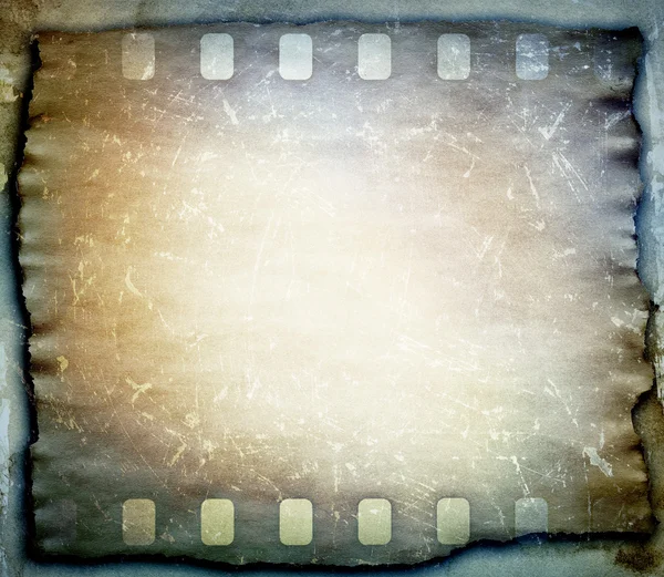 Grunge scratched film strip background — Stock Photo, Image