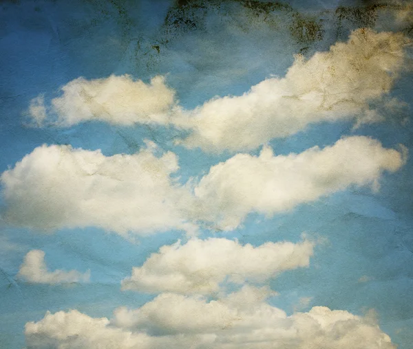 Vintage clouds and sky on crumpled paper texture. — Stock Photo, Image