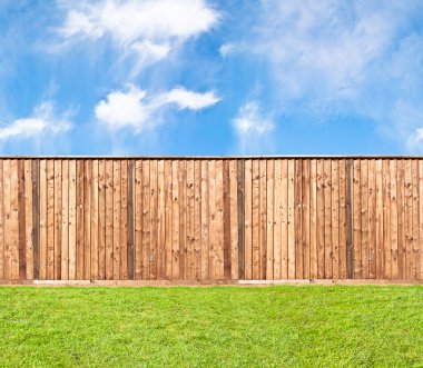Wooden fence at the grass clipart