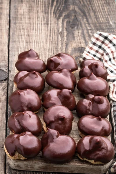 Homemade Profiteroles Covered Chocolate Wooden Table — Stock Photo, Image