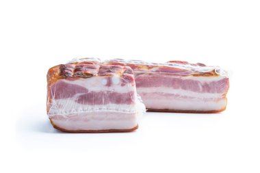 Smoked  and boiled bacon in vacuum pack isolated on white 