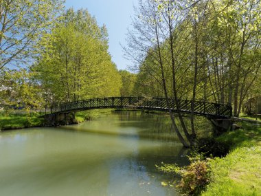 Metallic footbridge on the Indrois river, France