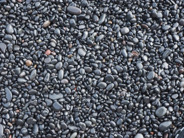 Pedra preta seixos pedras minerais fundo — Fotografia de Stock