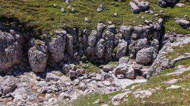 Rocky formations and grassy lands