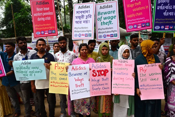 Activists of Five Garments workers organization stage a protest rally against Adidas brand demanding due wages11.7 million us dollars to workers of eight factories supplied by Adidas brand in Cambodia, in Dhaka, Bangladesh, August 18, 2022