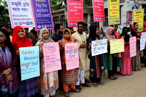 Activists of Five Garments workers organization stage a protest rally against Adidas brand demanding due wages11.7 million us dollars to workers of eight factories supplied by Adidas brand in Cambodia, in Dhaka, Bangladesh, August 18, 2022