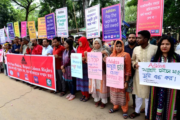 Activists of Five Garments workers organization stage a protest rally against Adidas brand demanding due wages11.7 million us dollars to workers of eight factories supplied by Adidas brand in Cambodia, in Dhaka, Bangladesh, August 18, 2022