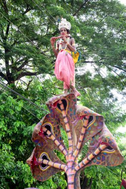 Hindu devotees take part in a procession during celebrations for the 'Janmashtami' festival, which marks the birth of Hindu god lord Krishna, in Dhaka, Bangladesh, on August 19, 2022.