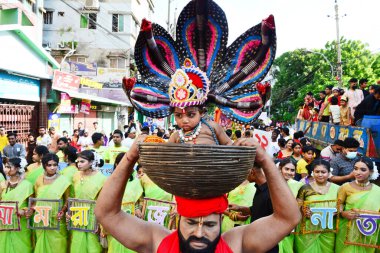 Hindu devotees take part in a procession during celebrations for the 'Janmashtami' festival, which marks the birth of Hindu god lord Krishna, in Dhaka, Bangladesh, on August 19, 2022.