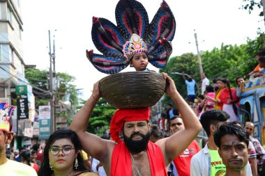 Hindu devotees take part in a procession during celebrations for the 'Janmashtami' festival, which marks the birth of Hindu god lord Krishna, in Dhaka, Bangladesh, on August 19, 2022.