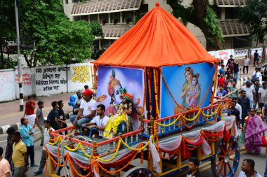 Hindu devotees take part in a procession during celebrations for the 'Janmashtami' festival, which marks the birth of Hindu god lord Krishna, in Dhaka, Bangladesh, on August 19, 2022.