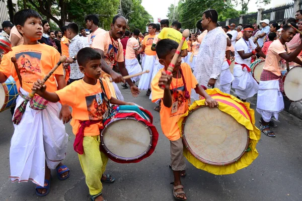 Hindu devotees take part in a procession during celebrations for the 'Janmashtami' festival, which marks the birth of Hindu god lord Krishna, in Dhaka, Bangladesh, on August 19, 2022.