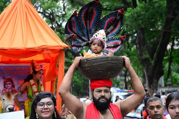 Hindu devotees take part in a procession during celebrations for the 'Janmashtami' festival, which marks the birth of Hindu god lord Krishna, in Dhaka, Bangladesh, on August 19, 2022.