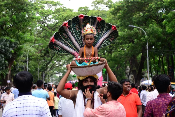 Hindu devotees take part in a procession during celebrations for the 'Janmashtami' festival, which marks the birth of Hindu god lord Krishna, in Dhaka, Bangladesh, on August 19, 2022.