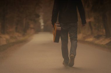 with guitar on the way