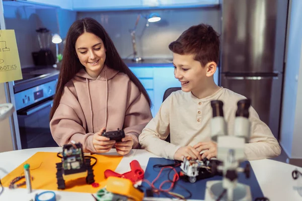 Children making a robot at home. Education in robotic at home.