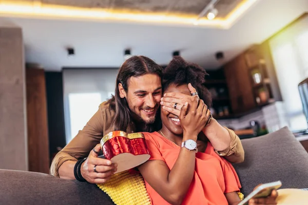 Handsome Guy Covering His Girlfriend Eyes Giving Gift Box — Stock Photo, Image