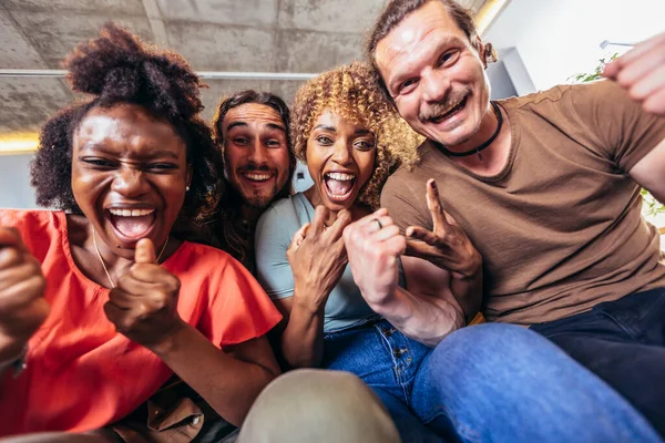 Selfie of young smiling friends having fun together