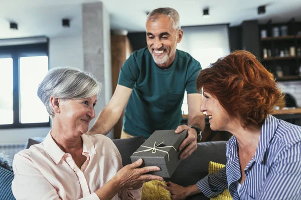 Group Middle Age Friends Celebrate Birthday Giving Gifts Home — Stock Fotó