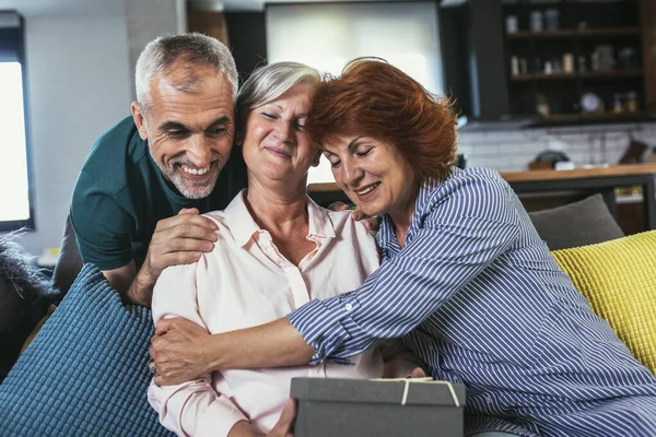 Group Middle Age Friends Celebrate Birthday Giving Gifts Home — Stock Fotó