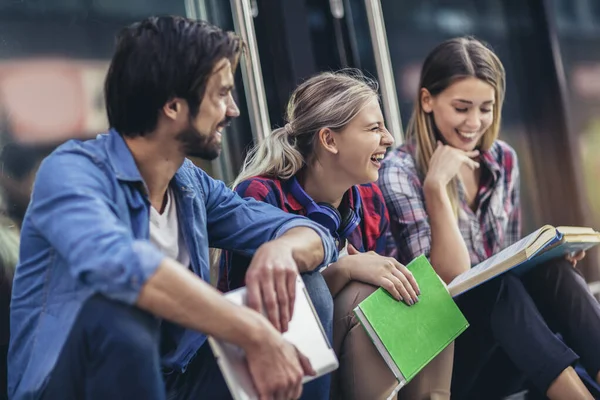 Group Happy University Students Talking While Sitting Outdoors Campus — Stok fotoğraf