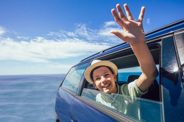 Boy in off road car, family vacation concept