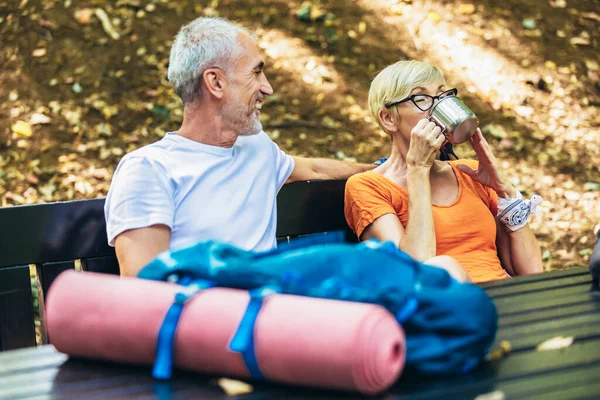 Mature Couple Sitting Drink Coffee While Resting Forest Hiking — Stock Fotó