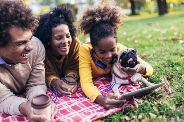 Beautiful Young Family Lying Picnic Blanket Dog Enjoying Autumn Day —  Fotos de Stock