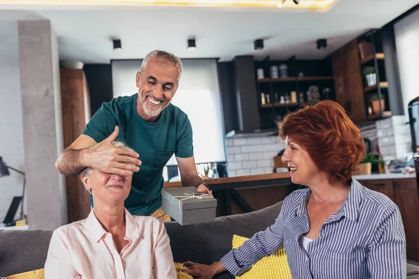 Group Middle Age Friends Celebrate Birthday Giving Gifts Home — Foto de Stock