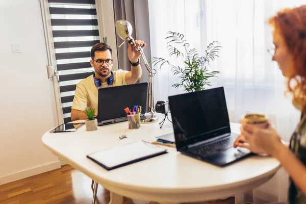 Young millennial couple working at home. Concept of freelance and remote work