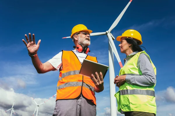 Windmill engineer inspection and progress check wind turbine at construction site