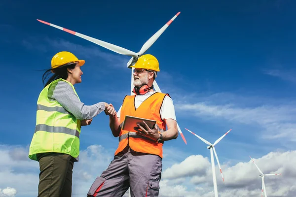 Windmill engineer inspection and progress check wind turbine at construction site