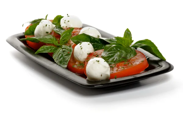 Caprese on Black Plate — Stock Photo, Image