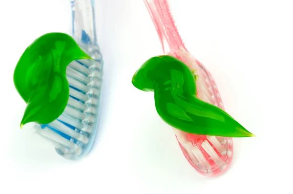 Tannkrem på tannbørster – stockfoto