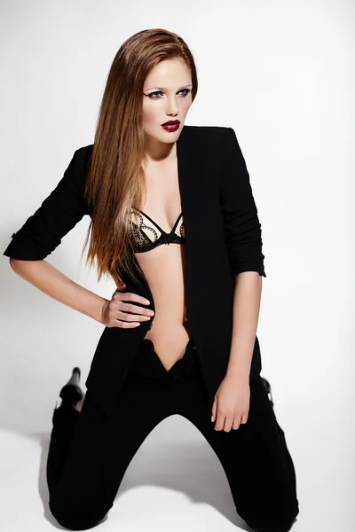 High fashion look.glamor portrait of beautiful sexy stylish Caucasian young woman model in black cloth — Stock Photo, Image