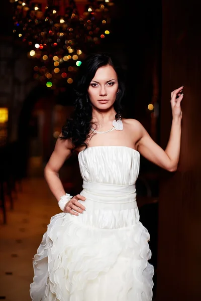 Happy beautiful sexy bride brunette girl woman in white wedding dress with hairstyle and bright makeup in interior — Stock Photo, Image