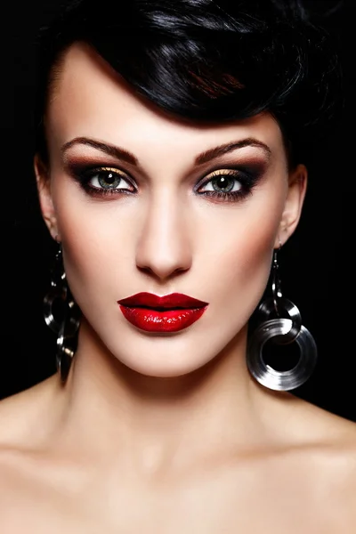 High fashion look.glamor closeup portrait of beautiful sexy brunette Caucasian young woman model with bright makeup, with red lips, with perfect clean skin Stock Image